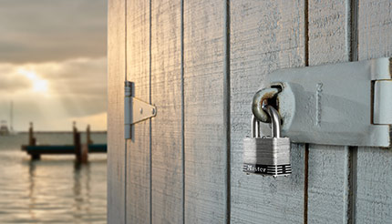 A padlock securing a door at a dock